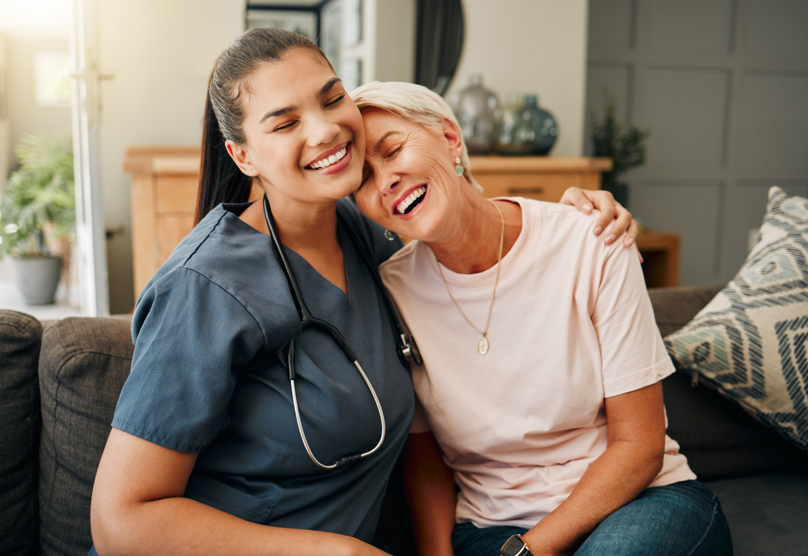 Nurse embracing a smiling client